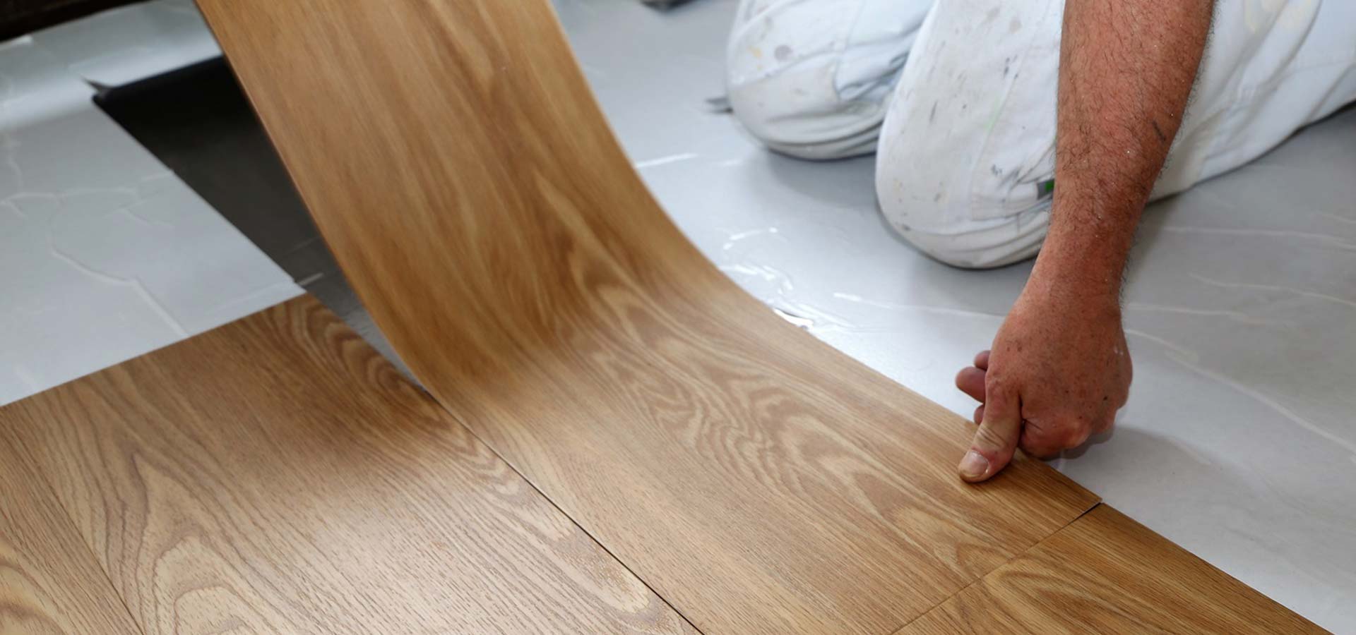 Man Laying Vinyl Flooring